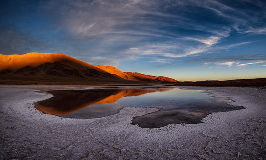 Vast salt flats under the open sky—symbolizing the essential role of natural salt in hydration, endurance, and optimal health.