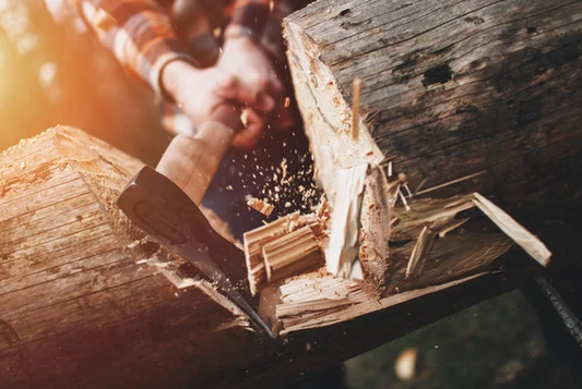 A rugged axe chopping through a log, symbolizing strength, resilience, and the power of natural testosterone optimization.