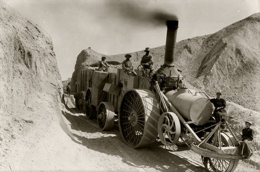 An old black-and-white photo of a steam tractor hauling borax from the mines—showcasing the strength, perseverance, and power of this natural mineral, supporting testosterone health.