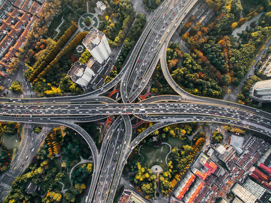 A busy highway cloverleaf in the urban jungle—symbolizing the need for aromatase inhibitors to navigate hormonal balance amidst modern environmental stress.